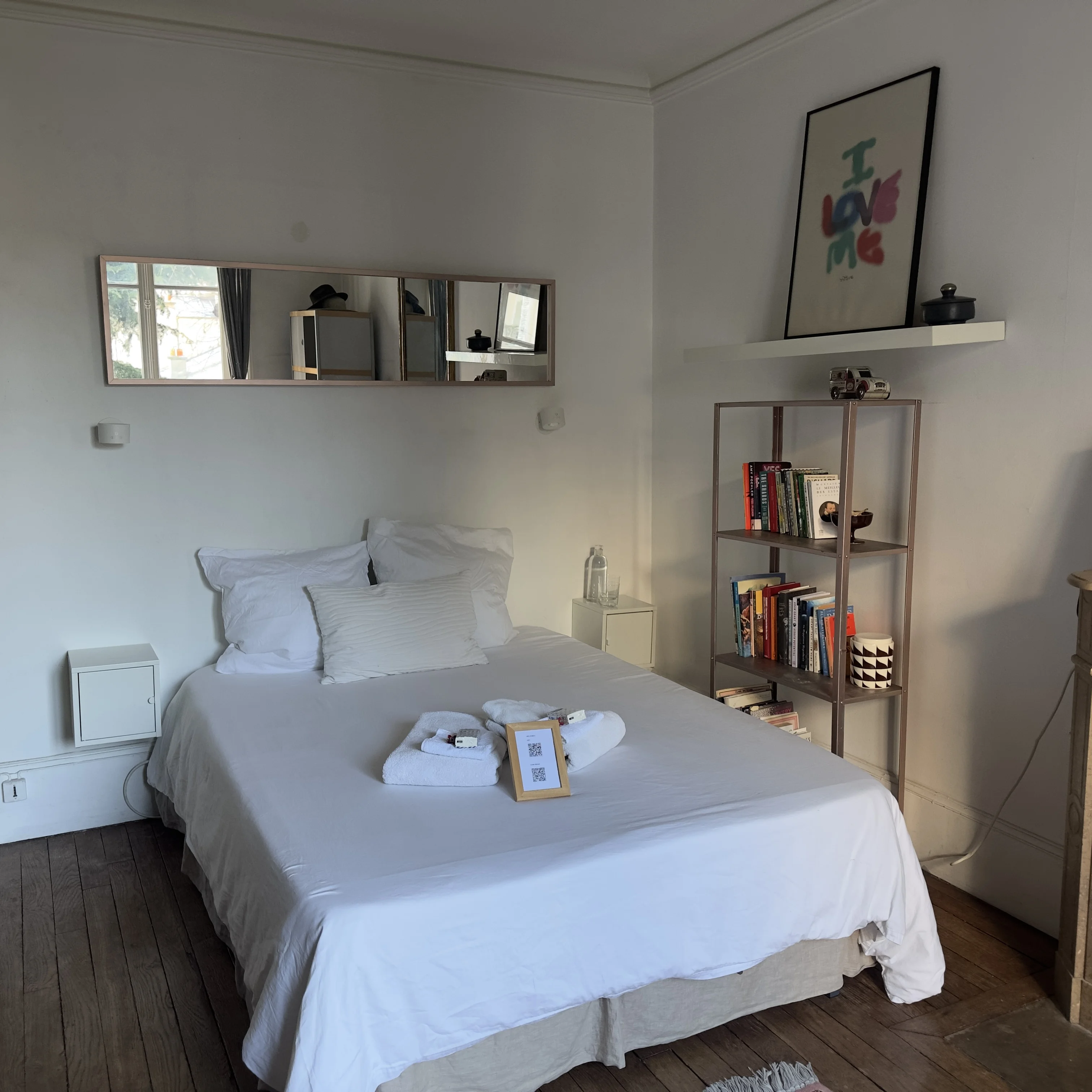 Bedroom with ornate mirror